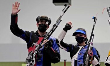 U.S. air rifle team waves