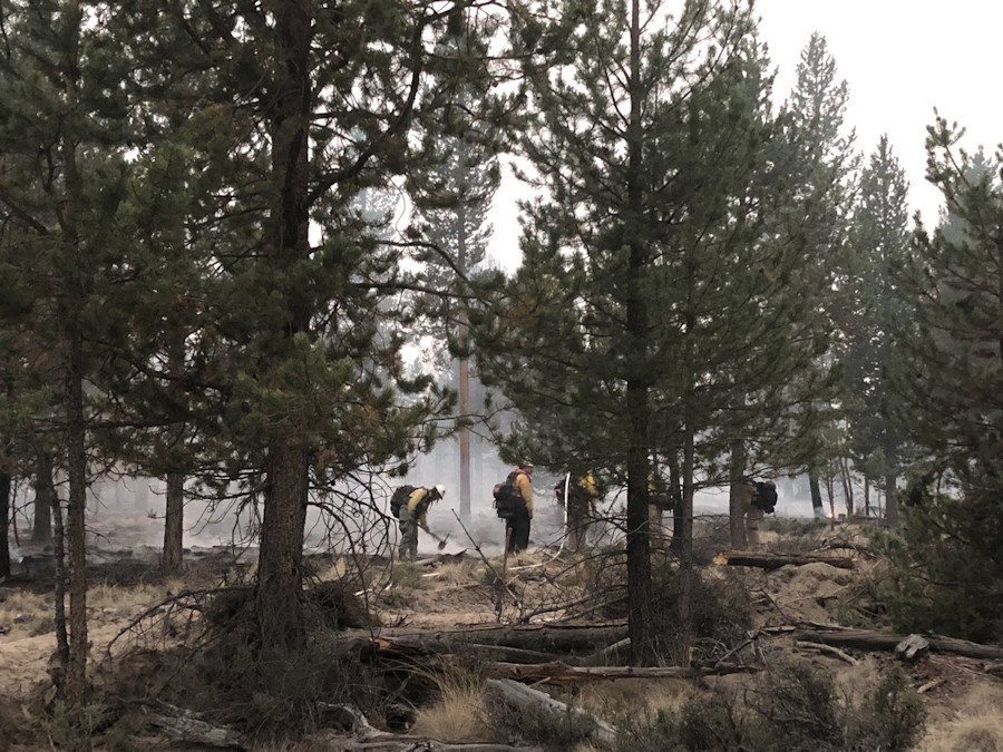 Crews from several agencies worked to stop a fire that broke out Saturday east of Crescent, prompting some evacuations