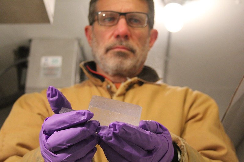 Oregon State University Professor Ed Brook holds a piece of 2 million-year-old ice