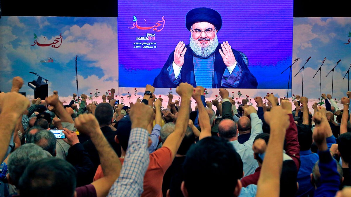 <i>AFP/Getty Images</i><br/>Hezbollah leader Hassan Nasrallah is cheered by supporters during a speech in November 2019.