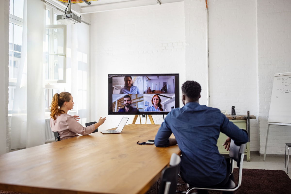 <i>Luis Alvarez/Digital Vision/Getty Images</i><br/>Think all-remote meetings are difficult? Running an effective and productive meeting is going to be even harder in a hybrid office...at least at first.