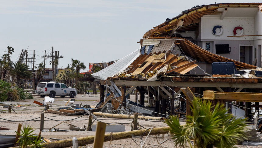 <i>Mickey Welsh/USA Today Network</i><br/>A Louisiana State Trooper keeps watch over damaged homes on Grand Isle on Tuesday.
