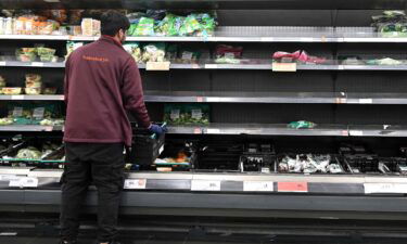Britain delays Brexit border checks as food industry warns of permanent shortages. A worker here restocks empty shelves inside a Sainsbury's supermarket in London on September 7.