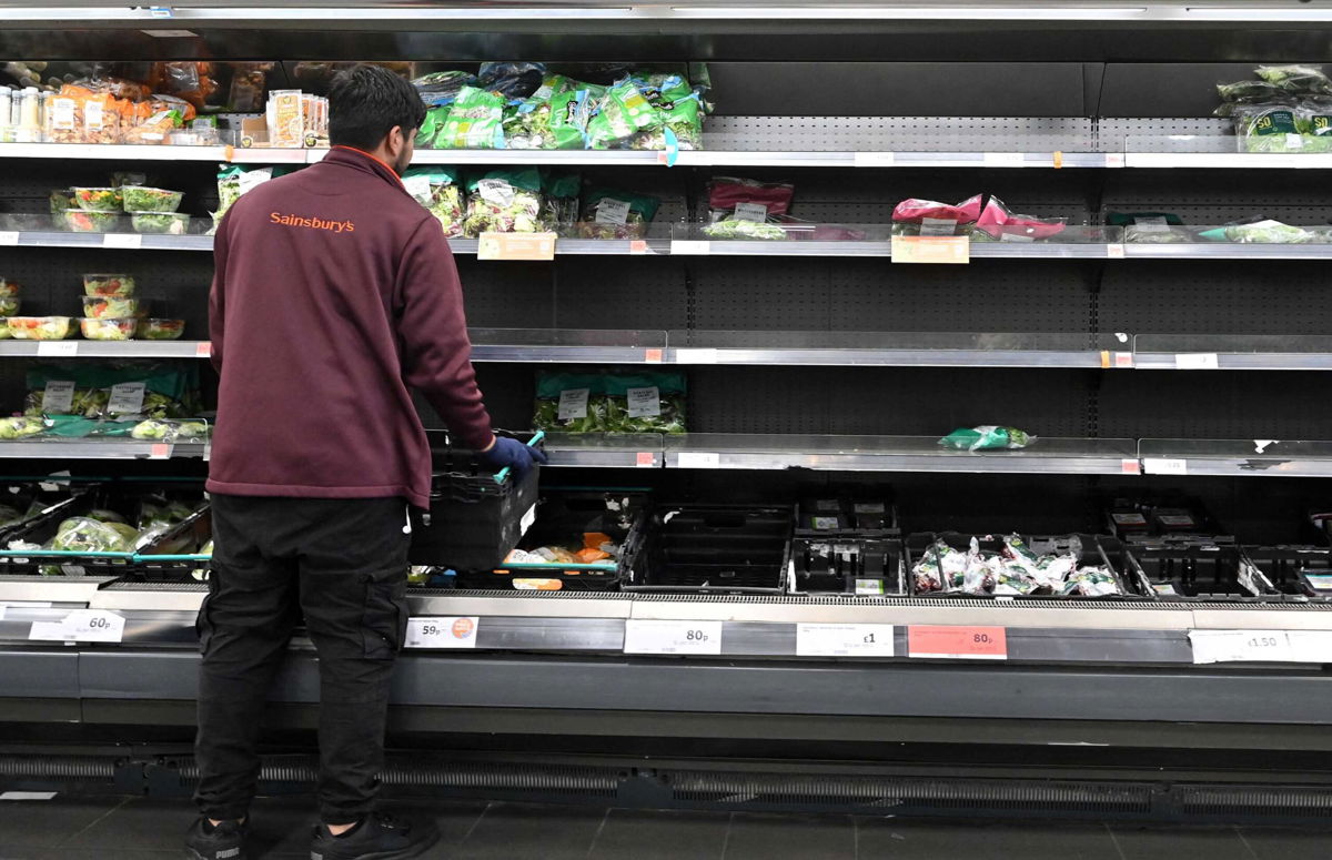 <i>Justin Tallis/AFP/Getty Images</i><br/>Britain delays Brexit border checks as food industry warns of permanent shortages. A worker here restocks empty shelves inside a Sainsbury's supermarket in London on September 7.