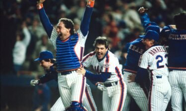Gary Carter and Wally Backman celebrate after winning the 1986 World Series between the New York Mets and the Boston Red Sox.