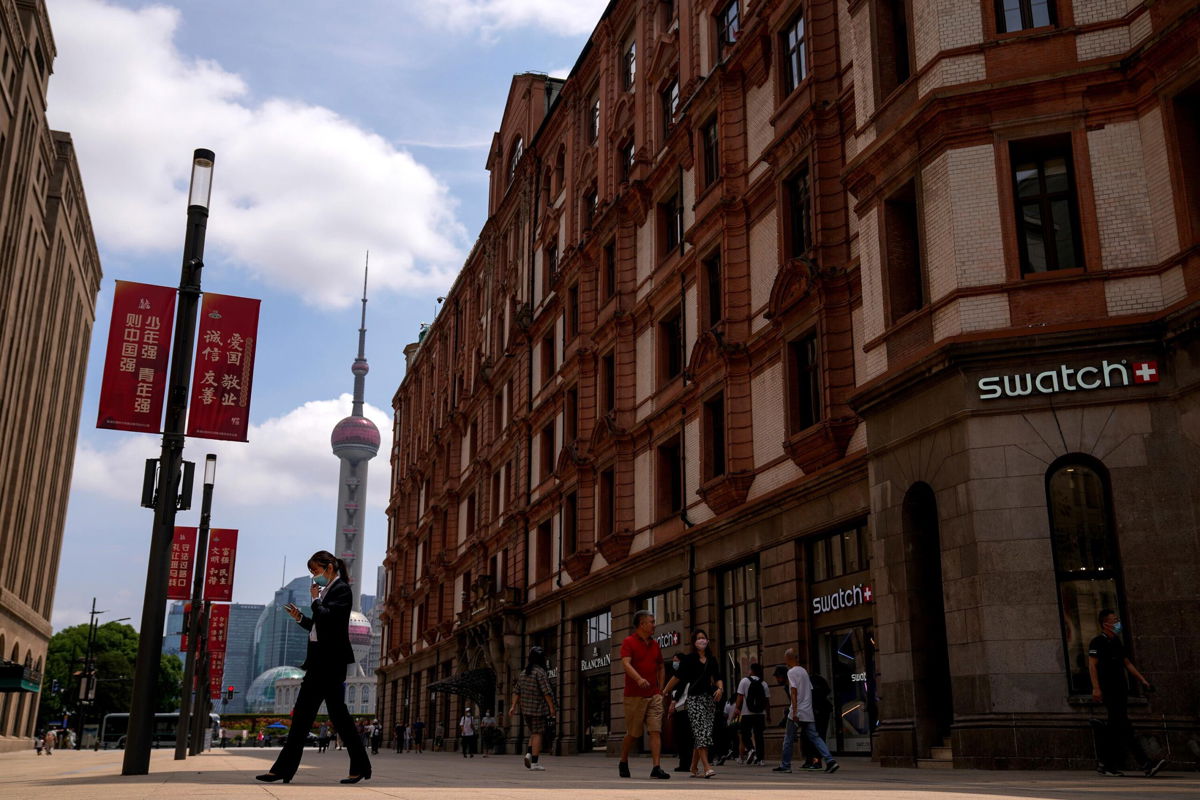<i>Andy Wong/AP</i><br/>The Delta variant has hit China's economy hard. Now a property crunch is looming. Pictured is a shopping street in Shanghai