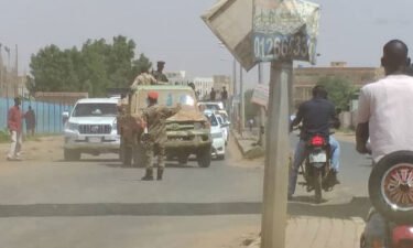 Sudanese soldiers block the road for taking precautions after a failed coup attempt in Khartoum