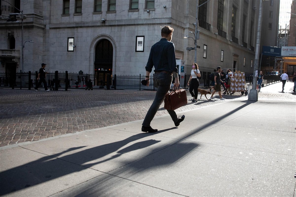 <i>Michael Nagle/Bloomberg/Getty Images</i><br/>Pedestrians pass in front of the New York Stock Exchange in New York