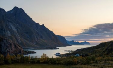 Norway moves into the 'very high' risk category for travel. The sun sets in Tangstad fjord