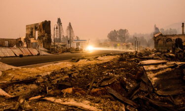 Burnt debris seen on the road side in the town of Greenville after being decimated by the Dixie fire which has grown to over 500