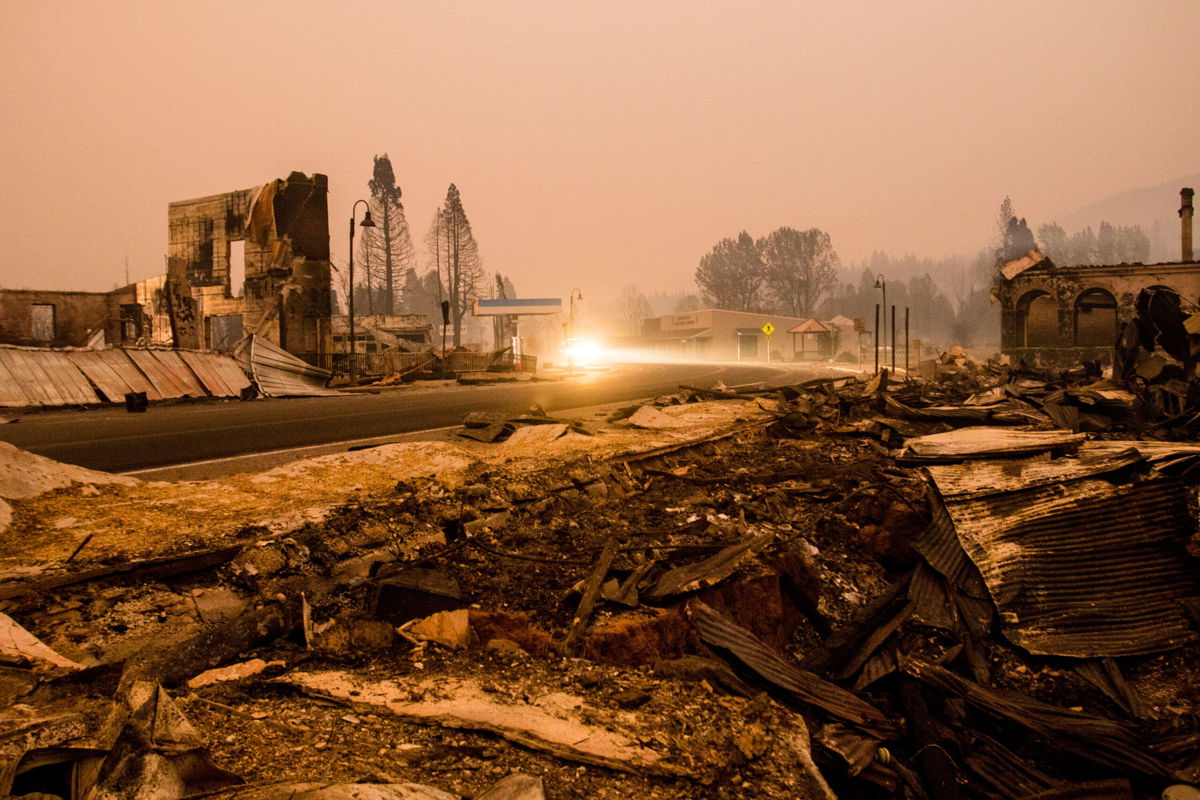 <i>Ty O'Neil/SOPA Images/LightRocket/Getty Images</i><br/>Burnt debris seen on the road side in the town of Greenville after being decimated by the Dixie fire which has grown to over 500