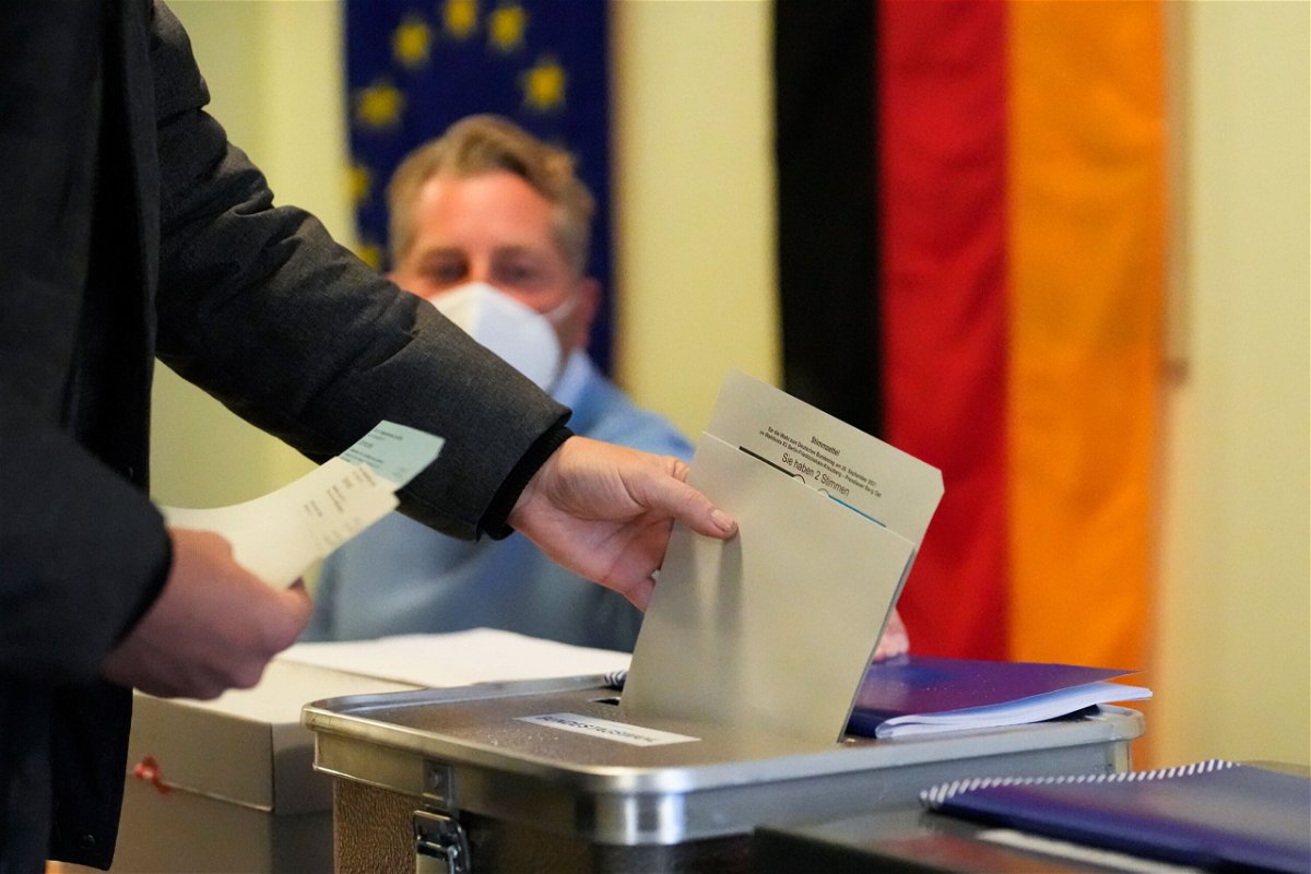 <i>Markus Schreiber/AP</i><br/>A man casts his vote in Germany's national parliamentary election at a polling station in Berlin