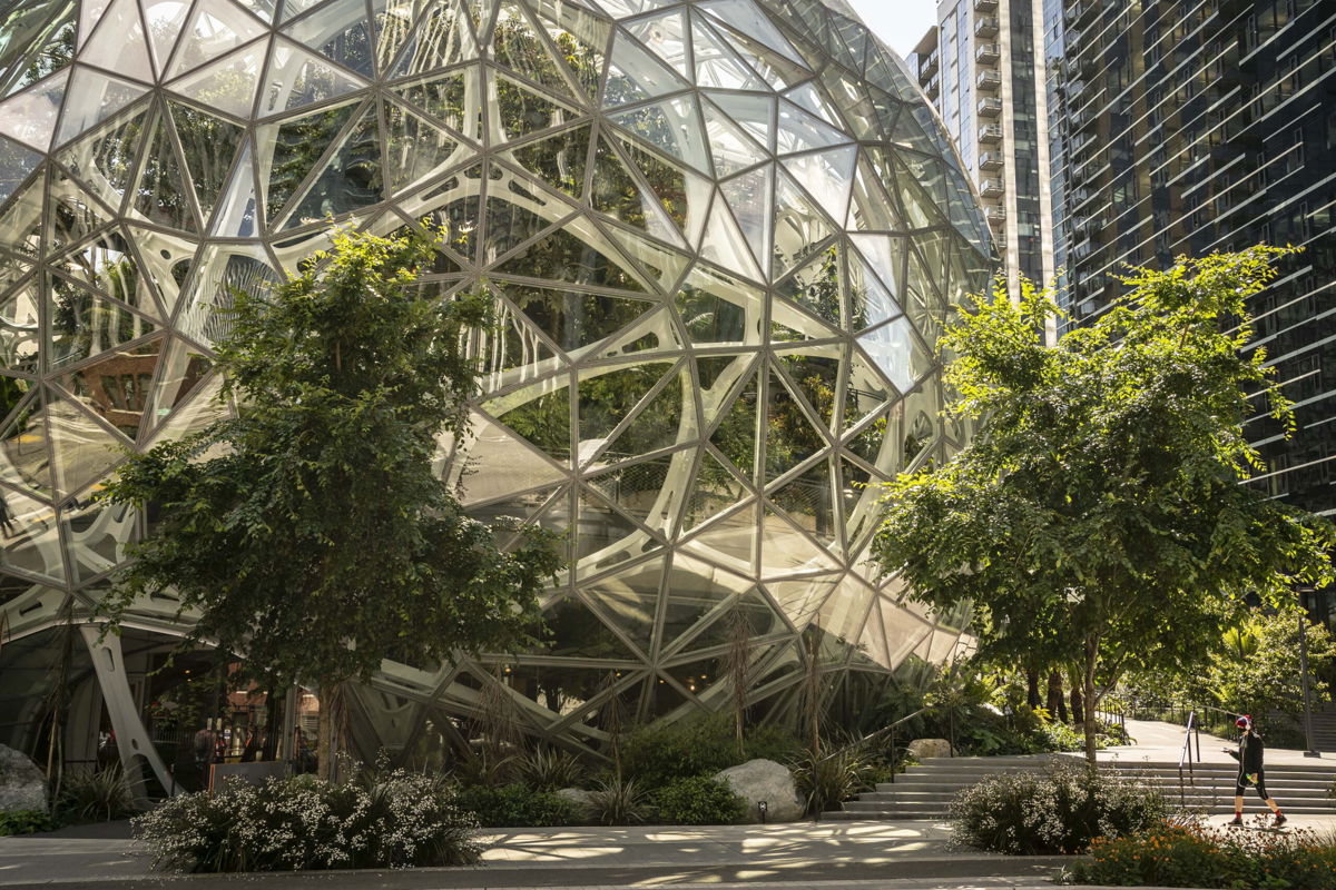 <i>David Ryder/Getty Images</i><br/>Amazon settles case with former employees who claim they were illegally fired. This image shows the Amazon headquarters in Seattle on May 20.