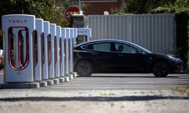 Tesla's 'full self-driving' could be days away. A Tesla car here sits parked at a Tesla Supercharger on September 23