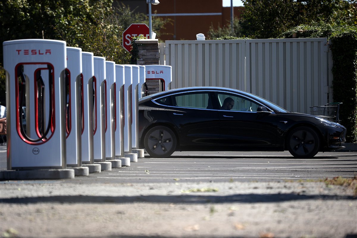 <i>Justin Sullivan/Getty Images</i><br/>Tesla's 'full self-driving' could be days away. A Tesla car here sits parked at a Tesla Supercharger on September 23