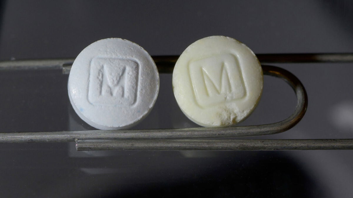 <i>Drug Enforcement Administration</i><br/>An image from the DEA shows an authentic 30mg oxycodone pill on the left