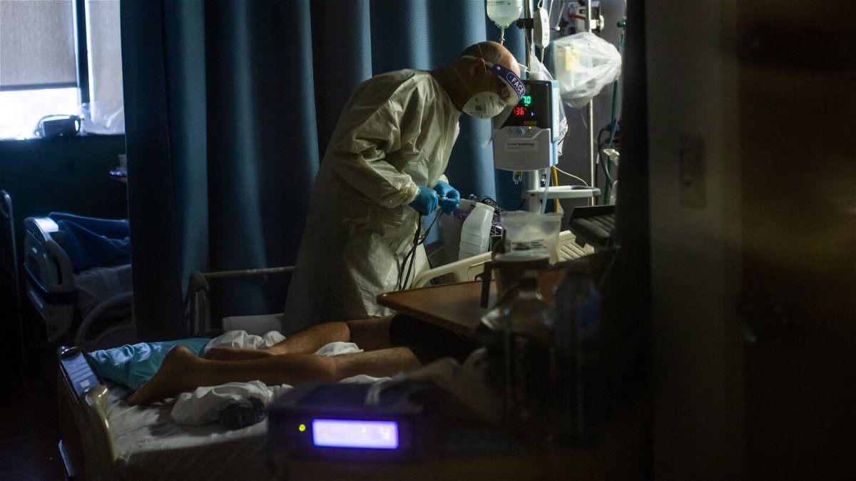 <i>APU GOMES/AFP via Getty Images</i><br/>A new analysis estimates a $5.7 billion price tag for treating unvaccinated Covid-19 patients in the last 3 months. A doctor here checks on a Covid-19 patient at Providence Cedars-Sinai Tarzana Medical Center in Tarzana
