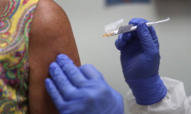 Black and Hispanic people miss out on Covid-19 testing and vaccinations. Pictured is a woman receiving the Covid-19 vaccine on August 07