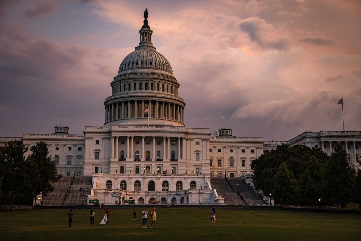<i>Samuel Corum/Getty Images</i><br/>The U.S. Capitol Building is seen as the sun sets on July 26