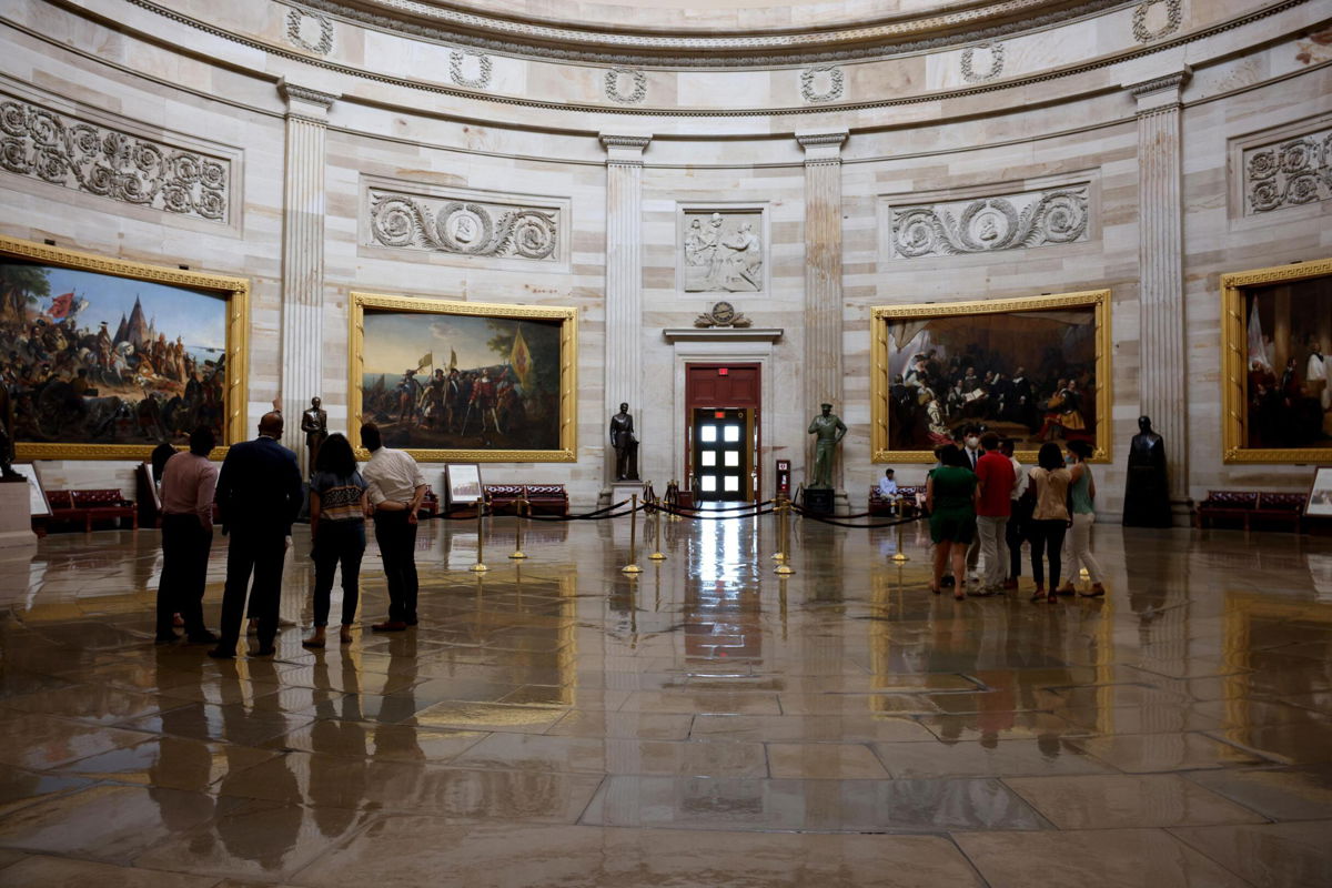 <i>Anna Moneymaker/Getty Images</i><br/>Staff members and interns admire the rotunda of the U.S. Capitol Building on August 6 in Washington.