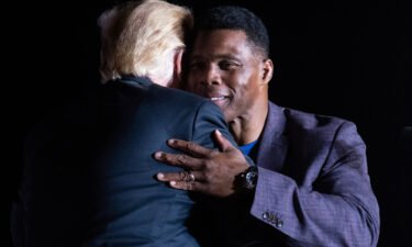 Former President Donald Trump hugs Georgia Senate candidate Herschel Walker during his Save America rally in Perry
