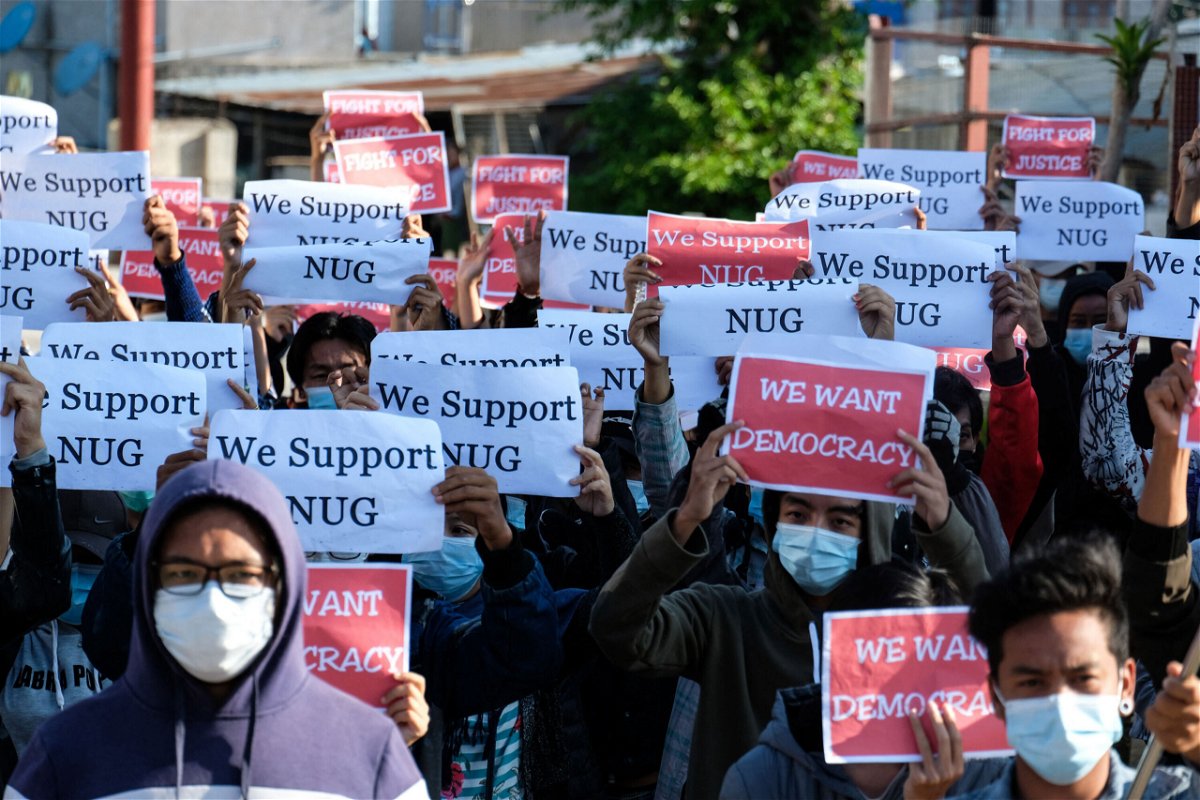 <i>STR/AFP/Getty Images</i><br/>Myanmar's shadow government is urging citizens across the country to revolt against the military junta. Protesters here hold posters in support of the National Unity Government (NUG) in Taunggyi