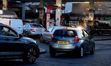 Soldiers will be on the roads 'in days' to help deliver fuel to service stations. Drivers queue for fuel at a service station in London