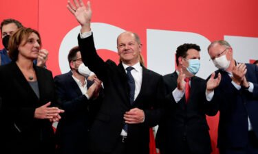 SPD's Olaf Scholz waves to his supporters after German parliament election at the party's headquarters in Berlin