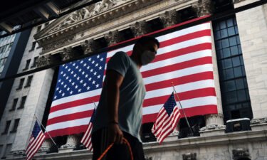 September is traditionally the worst of the year for stocks. People here walk by the New York Stock Exchange on September 11