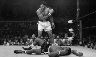 Muhammad Ali stands over Sonny Liston after dropping Liston with a short hard right on May 25