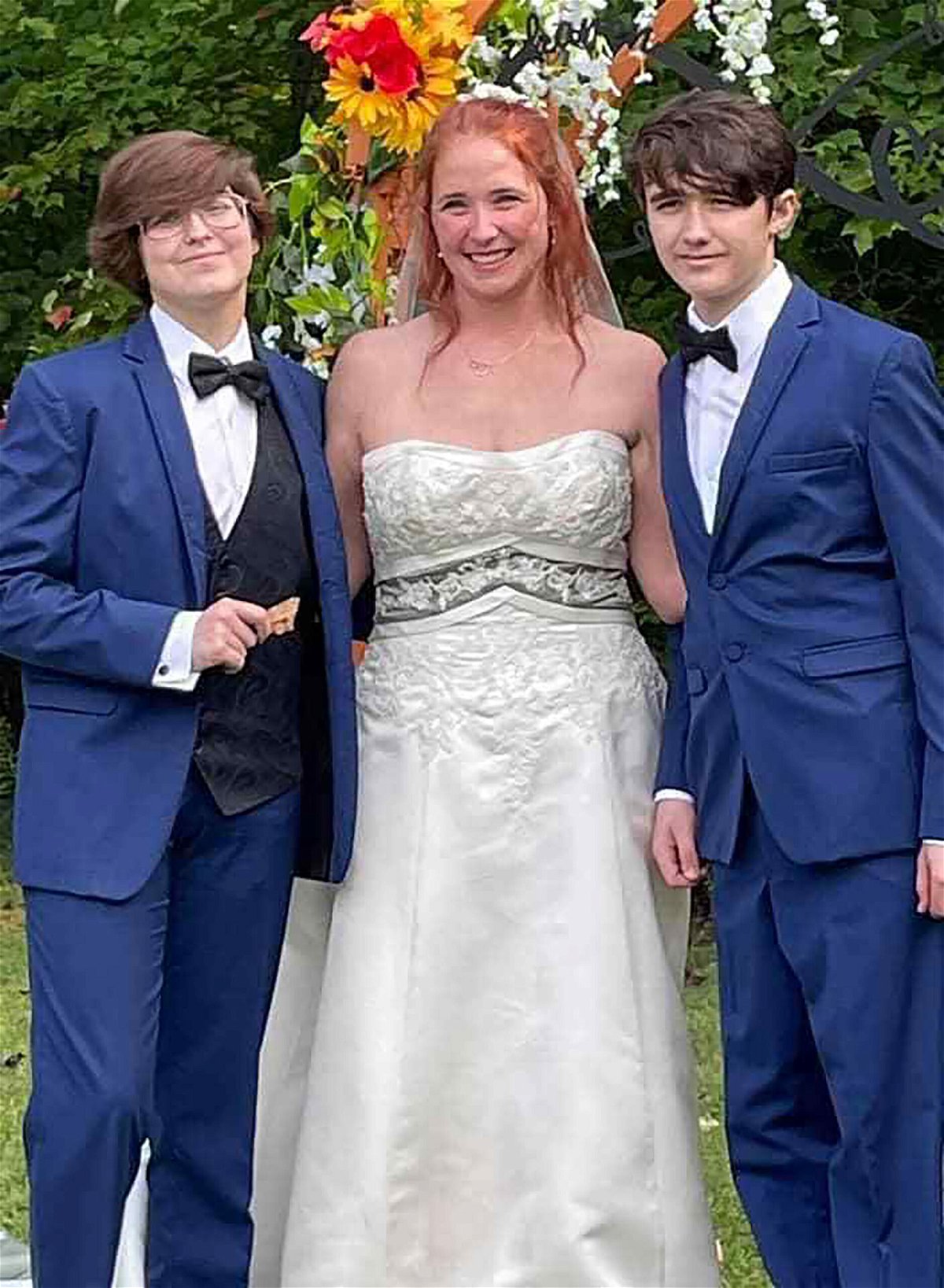 <i>Courtesy Karen Mahoney</i><br/>Karen Mahoney poses with her two sons at the full ceremony on September 25.