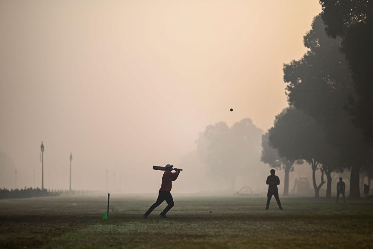 <i>Jewel Samad/AFP/Getty Images</i><br/>People playing cricket at a park in smoggy conditions in New Delhi on February 8.