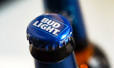 A Bud Light beer bottle is seen displayed in a store.