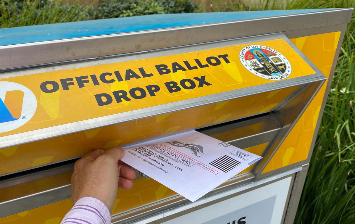 <i>Chris Delmas/AFP/Getty Images</i><br/>A person drops a ballot for the California gubernatorial recall election in Los Angeles