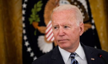 President Joe Biden faces a reckoning on his agenda as top aides start to temper expectations. Biden is seen here at the White House on August 25