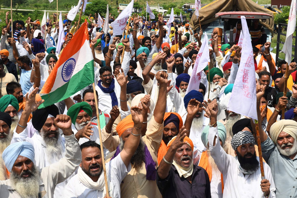 <i>Narinder Nanu/AFP/Getty Images</i><br/>Farmers shout slogans in protest against the government's agricultural reforms