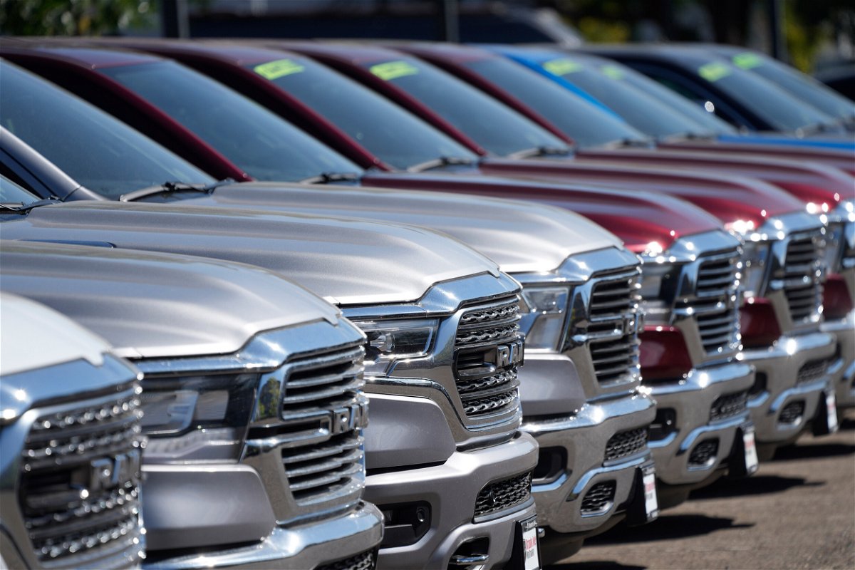<i>David Zalubowski/AP</i><br/>A lone line of unsold 2021 pickup trucks in an empty storage lot at a Dodge Ram dealership on Sept. 12 in Littleton