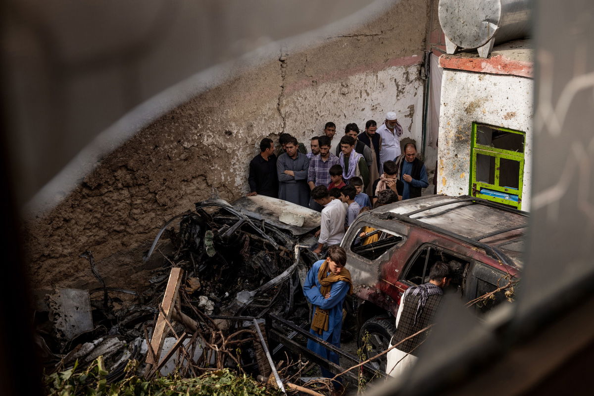 <i>Jim Huylebroek/The New York Times/Redux</i><br/>Relatives and neighbors inspect damage in the cramped courtyard of a house in Kabul