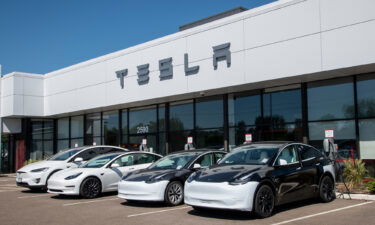 Cars at charging stations at a Tesla car dealership in Maplewood