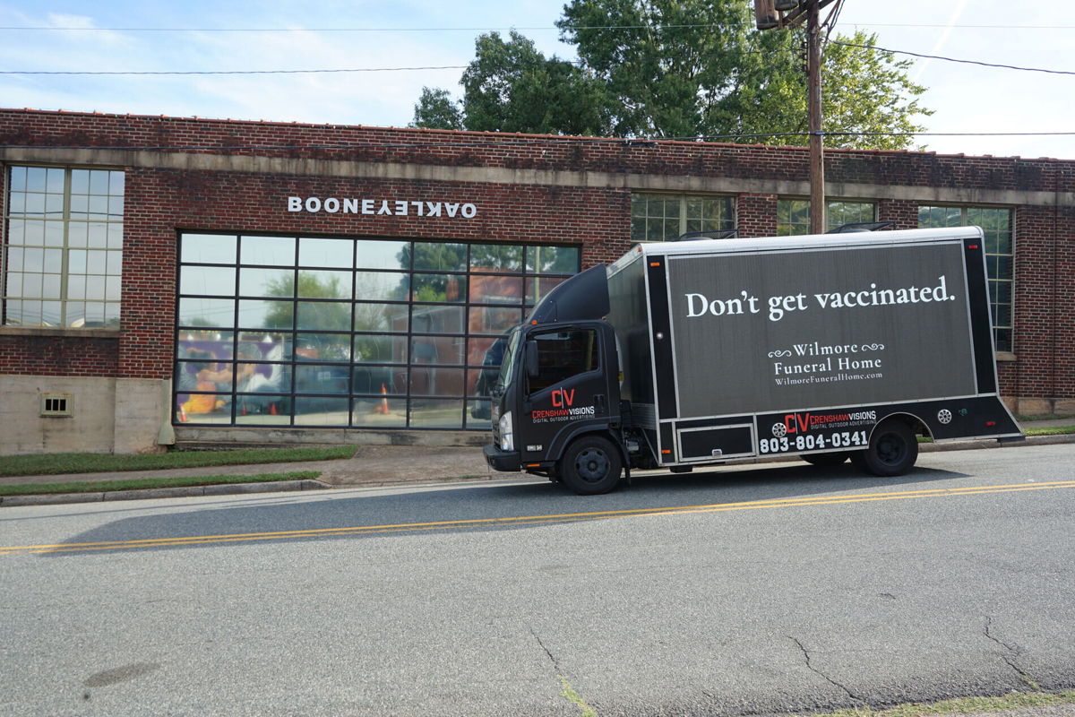 <i>Courtesy Laura Beebe/Boone Oakley</i><br/>A black truck advertising for 