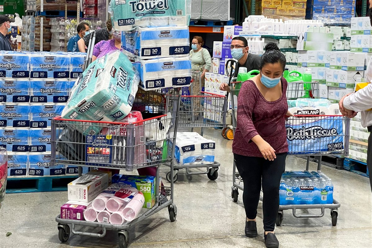 <i>Ringo Chiu/AP</i><br/>People buy toilet papers and paper towels at a Costco Wholesale store as panic buying following the coronavirus disease outbreak in Alhambra