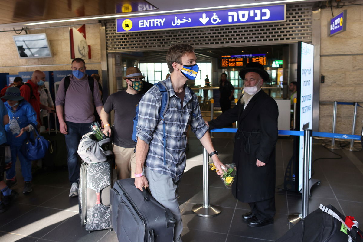 <i>Ronen Zvulun/Reuters</i><br/>Tourists walk at the Ben Gurion International Airport after entering Israel by plane