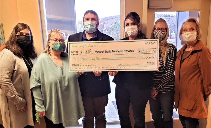 United Way of Central Oregon Crook County Ambassador Darleen Rodgers (right)  presents Rimrock Trail team with $12,000 grant (L to R) Michelle Duff, Peggy Gregg, Justyn Staten, Erica Fuller and Lynne Vigil