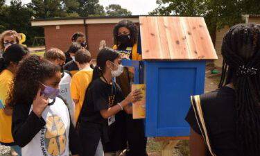 Members of the Rotary Club of Lawrenceville unveiled a new Little Library stand at the school's playground this past week