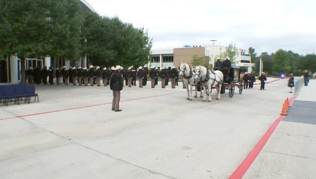 <i>KTRK</i><br/>Officers line up in front of a Houston funeral home on October 25 to honor Kareem Atkins