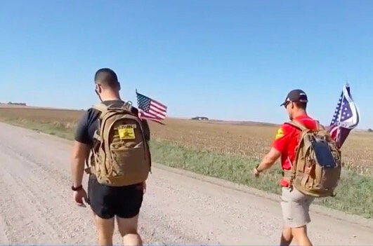 <i>KETV</i><br/>With flags and his backpack