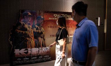 "The Battle at Lake Changjin" — commissioned by the Chinese government — has grossed an estimated 1.85 billion yuan ($287 million) since its release on Thursday. Movie goers are shown passing in front of a poster for "The Battle At Lake Changjin" in a cinema in Wuhan