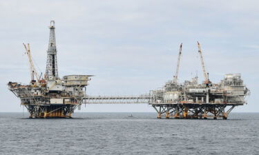 The shift to clean energy is sending the oil industry into decline. The oil platforms named Ellen (L) and Elly (R) are seen off the southern California coast on October 6