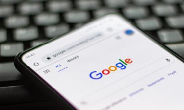 Google rolls out tool to help minors delete photos from search. Pictured is a closeup of a Google logo displayed on a phone screen.