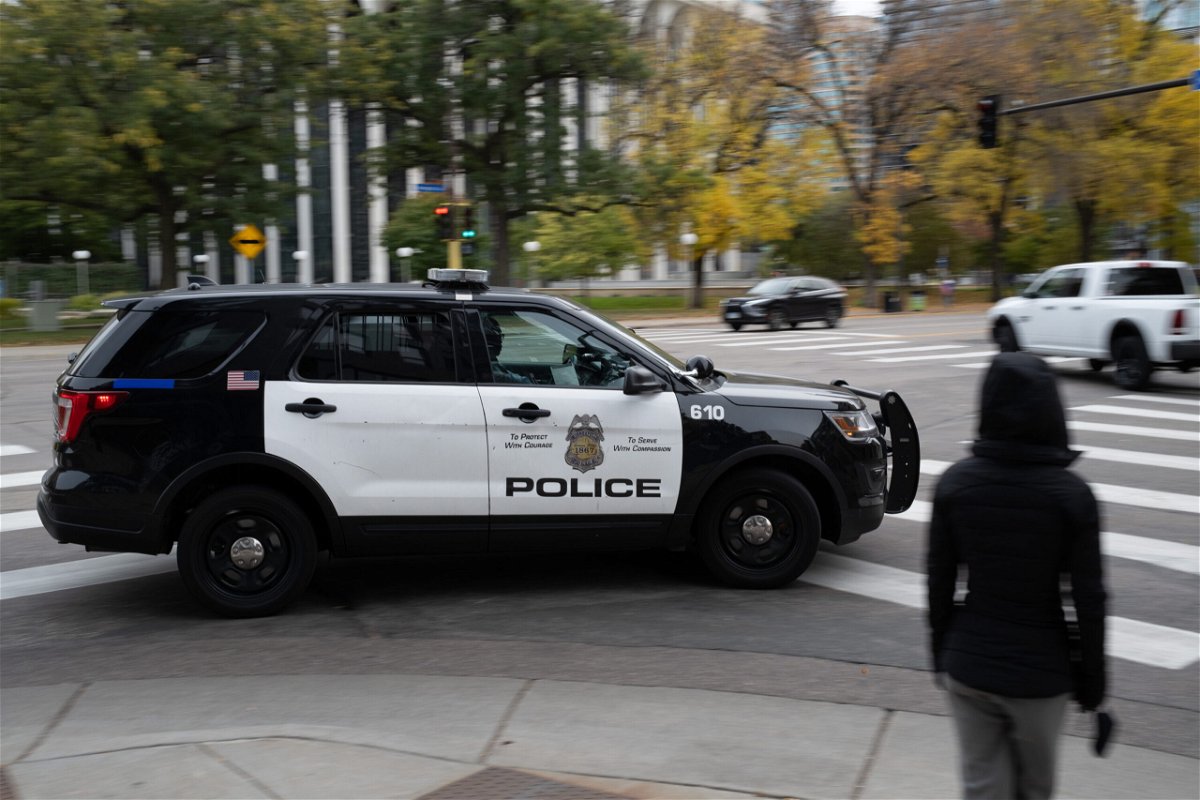 <i>Tim Evans/Bloomberg/Getty Images</i><br/>A police vehicle travels in downtown Minneapolis on Sunday